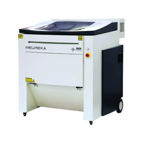 Laser system for cutting different materials, especially wood