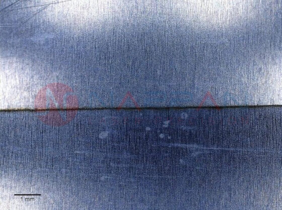 Microscope enhanced image of pulsed fiber laser cut aluminium foil