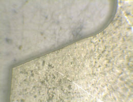 Microscope detail of CO2 laser cut plastic