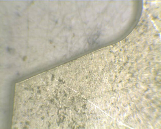 Microscope detail of CO2 laser cut plastic