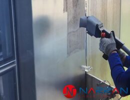 Close-up of laser precision cleaning on the metal surface of Central Park Tower.