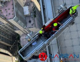 Comparison of Central Park Tower's metal surface before and after laser cleaning.