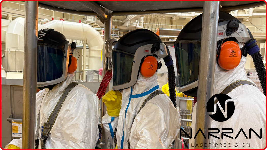 Workers wearing PPE during industrial laser cleaning